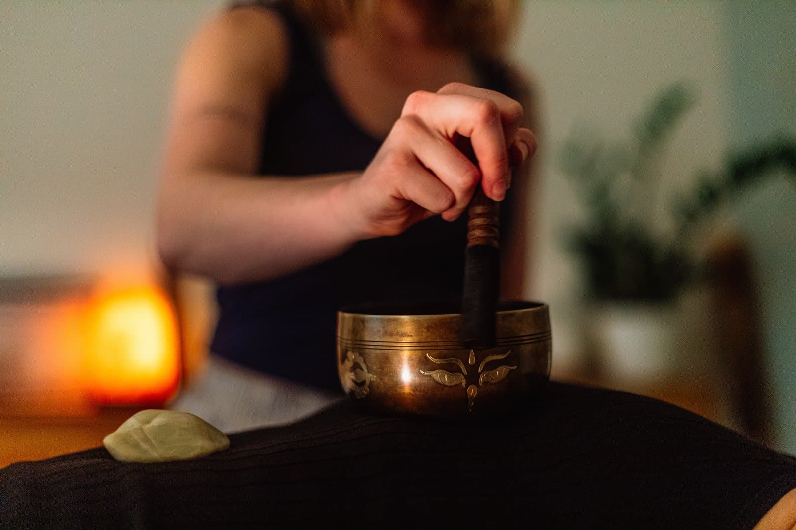 A singing bowl being played during a Soul Deep Yoga sound bath.